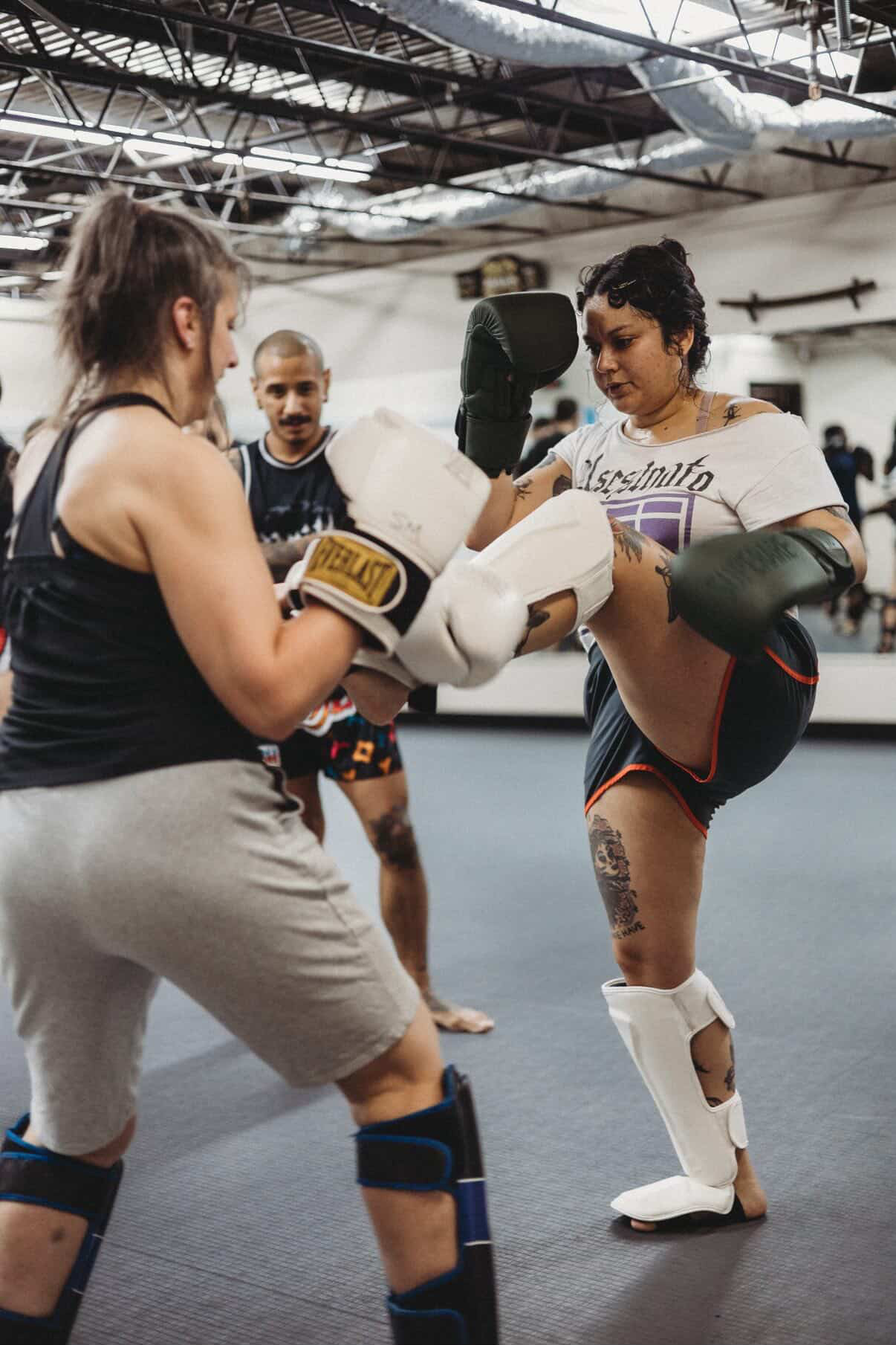 Women sparring at OCC Fight House Colorado Springs